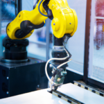 Robotic arm holding a piece of metal in a manufacturing facility